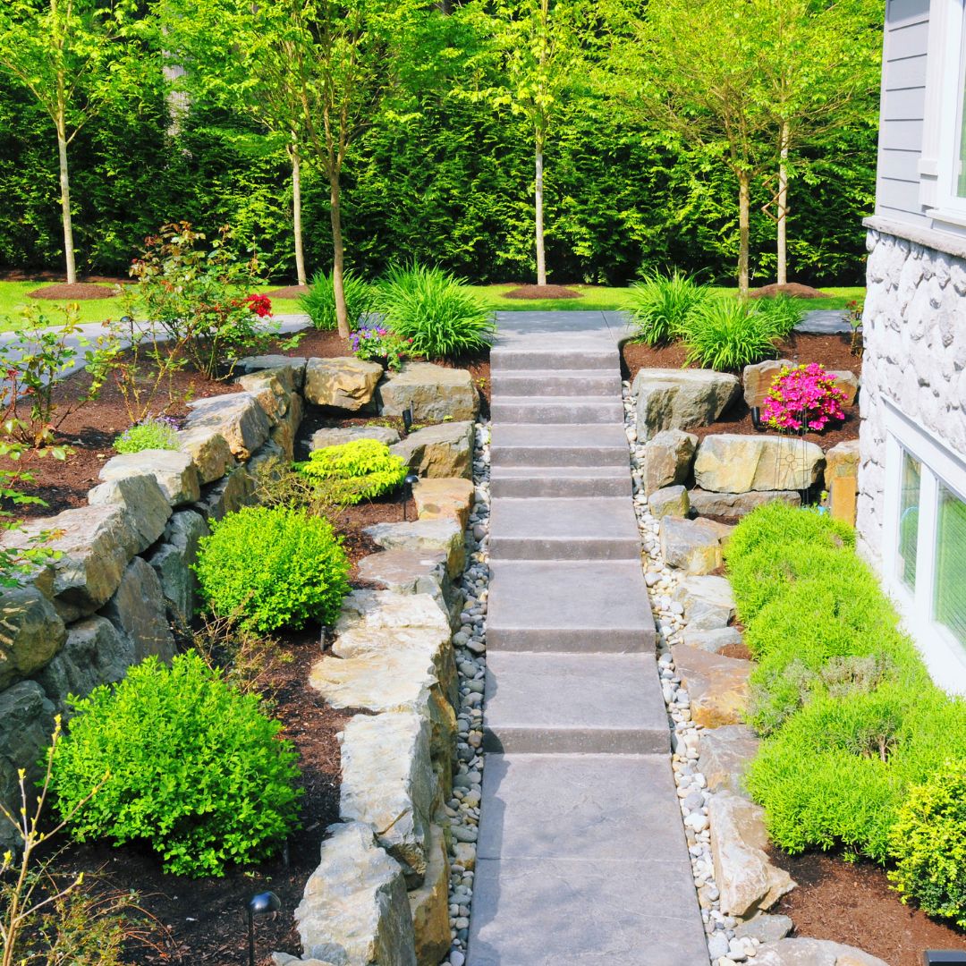 landscaping with stone stairs and bushes